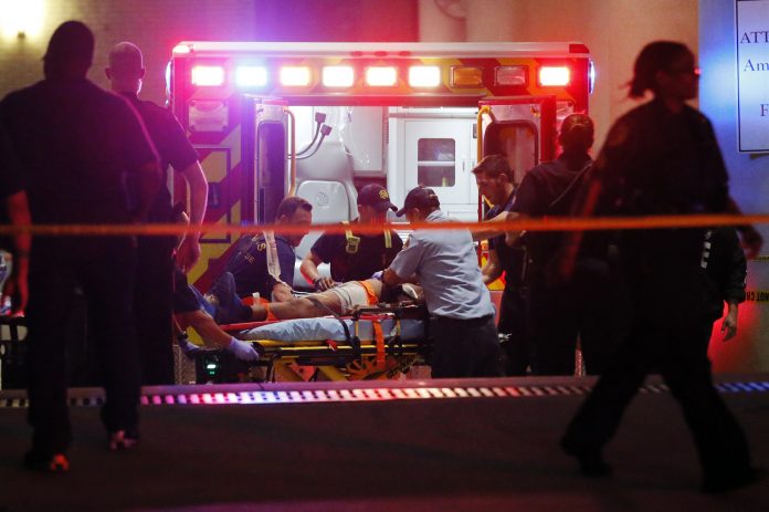 Image: Emergency responders administer CPR to an unknown patient