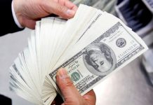 Dollar gains amid renewed worries about coronavirus restrictions in Asia