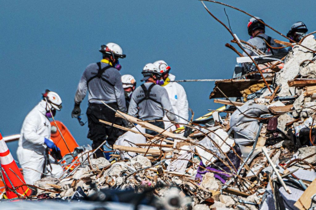 Search and rescue teams search the rubble of the Champlain Towers South condo building in Surfside, Fla., on July 2, 2021.